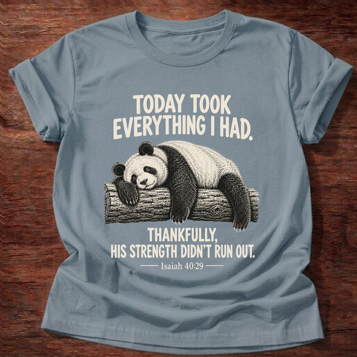 Stone Blue t-shirt printed with a panda sleeping draped over a log graphic and “Today took everything I had. Thankfully, His strength didn't run out.” Isaiah 40:29 faith based gift
