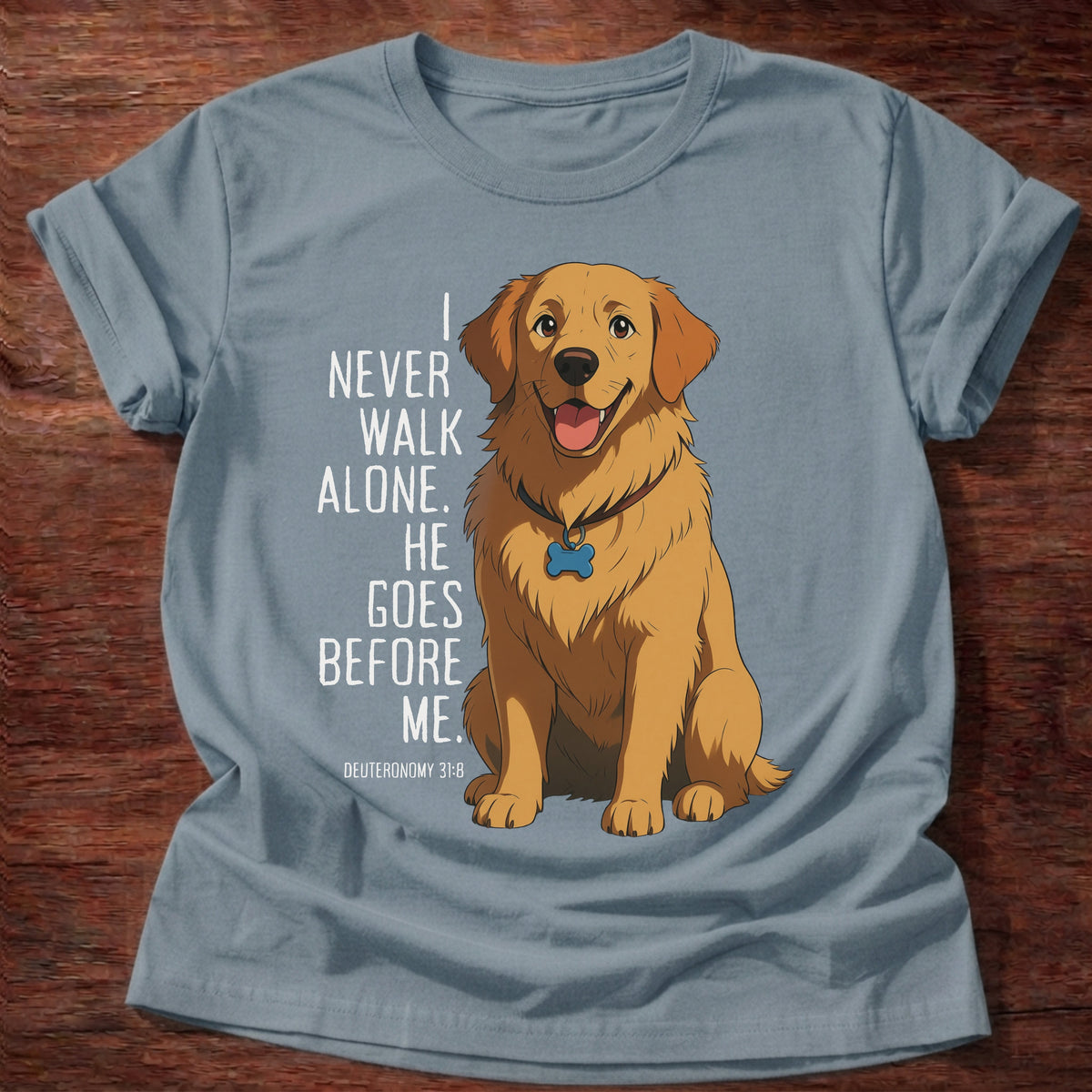 Stone Blue t-shirt printed with a loyal golden retriever graphic and “I never walk alone. He goes before me.” Deuteronomy 31:8 Christian shirt