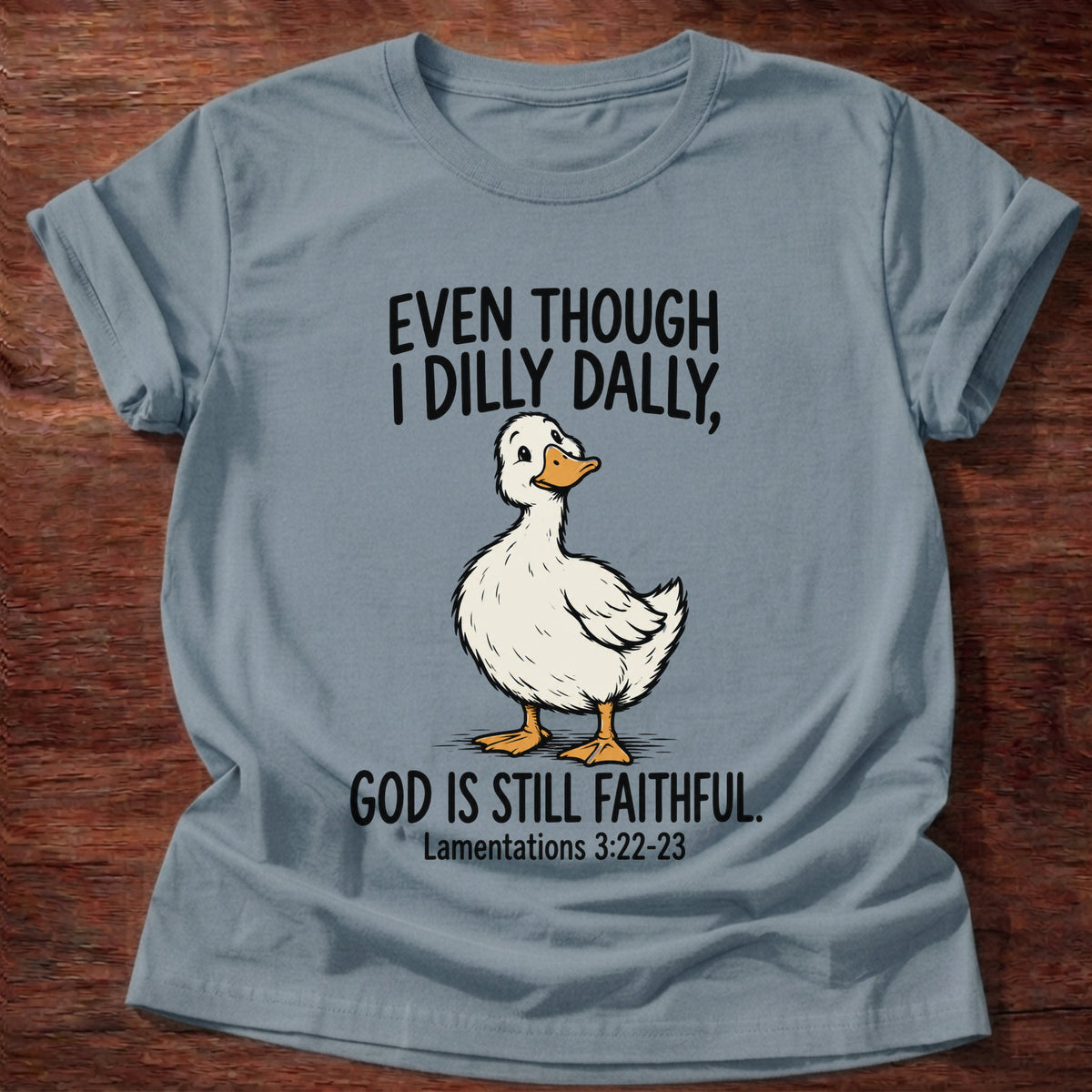 Stone Blue t-shirt printed with a duck graphic and 'Even though I dilly dally God is still faithful.' Lamentations 3:22-23 faith based gift