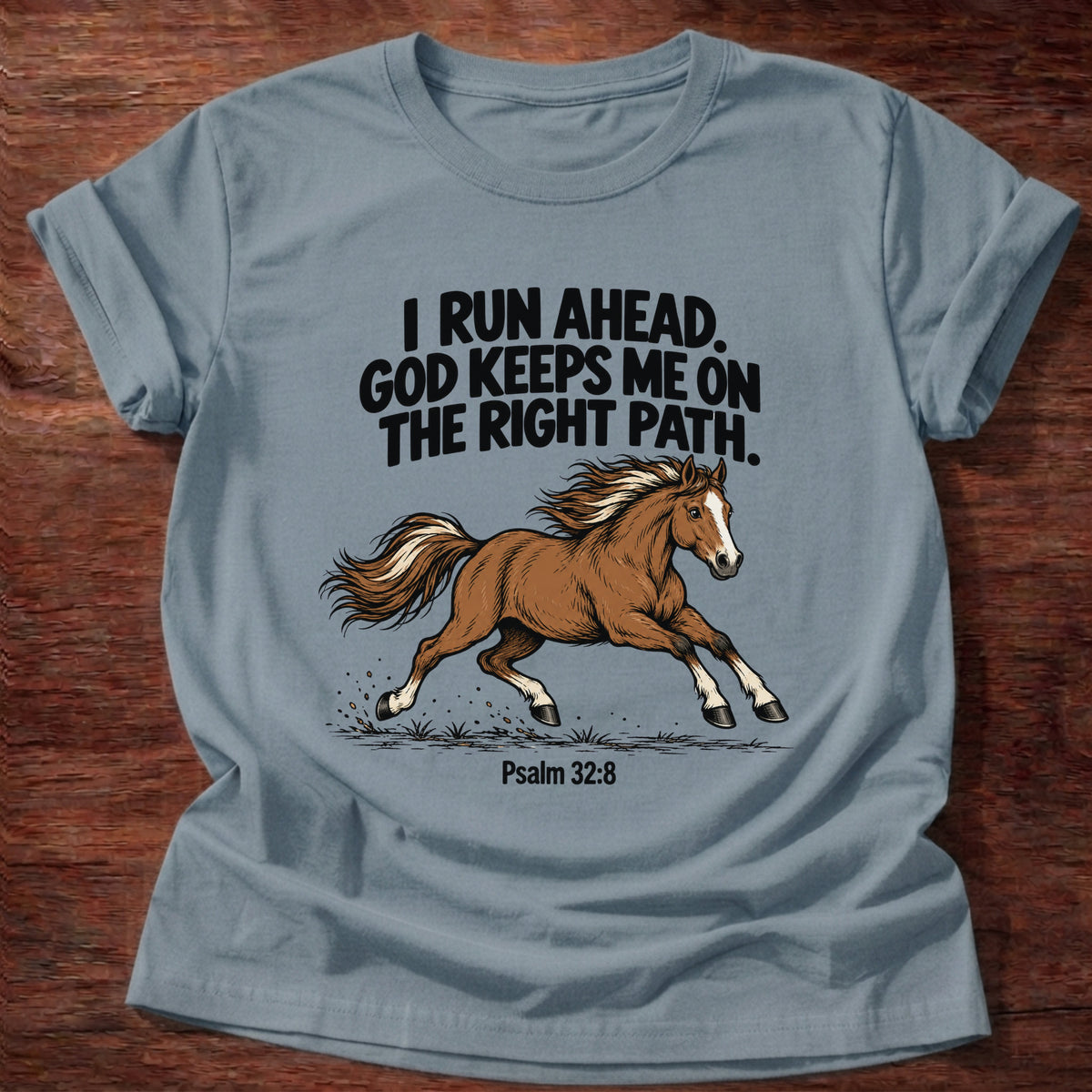 Stone Blue t-shirt printed with a running horse graphic and 'I run ahead. God keeps me on the right path.' Psalm 32:8 faith based gift