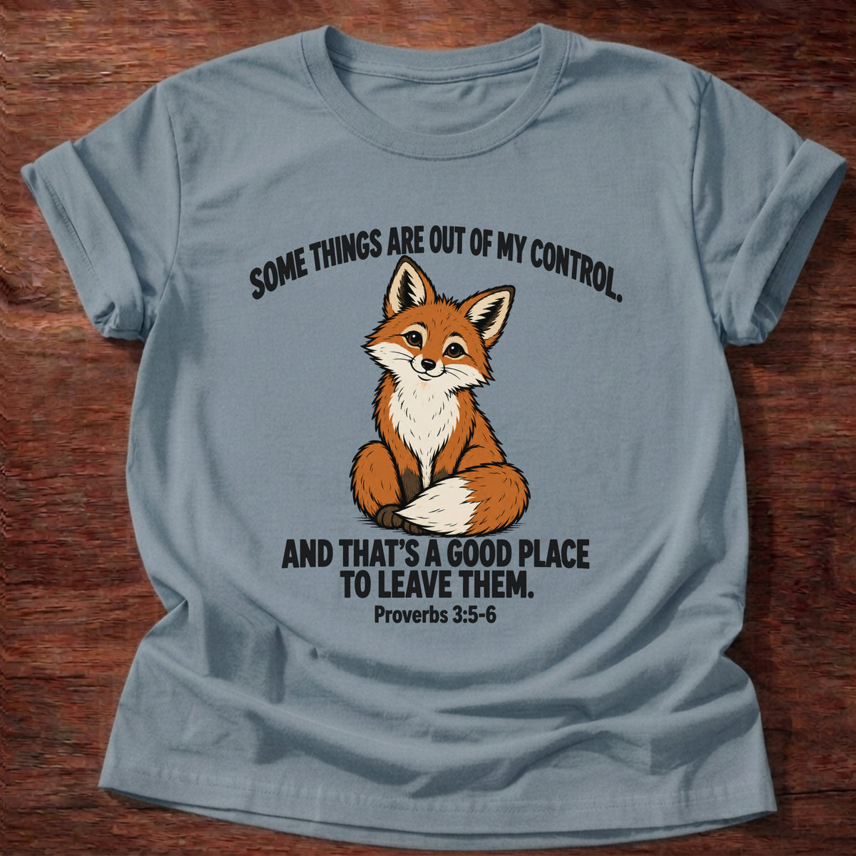 Stone Blue t-shirt printed with a fox graphic and 'Some things are out of my control. And that's a good place to leave them.' Proverbs 3:5-6 faith based gift