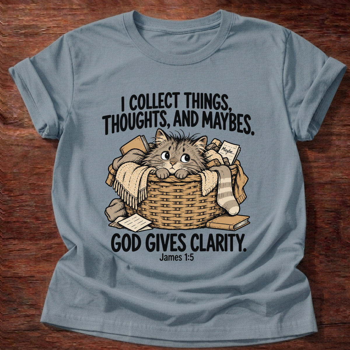 Stone Blue t-shirt printed with a squirrel and a pile of collected items graphic and 'I collect worries instead of trust. But God provides.' Matthew 6:25-26 faith based gift