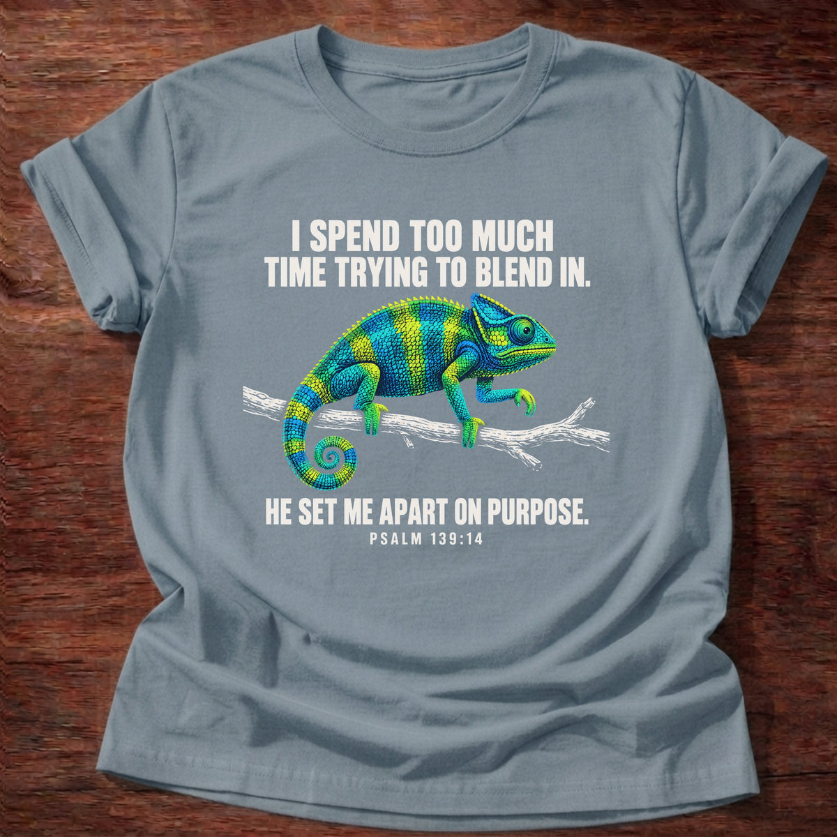 Stone Blue t-shirt printed with a chameleon blending into a branch graphic and 'I spend too much time trying to blend in. He set me apart on purpose.' Psalm 139:14 faith based gift