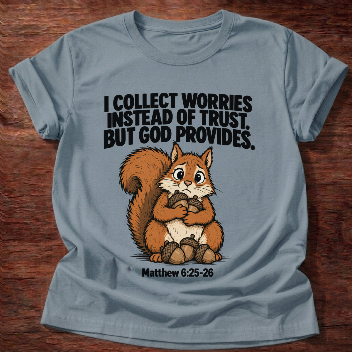 Stone Blue t-shirt printed with a raccoon digging through a bin graphic and 'I dig through things I should just leave to God.' Psalm 121:1-2 faith based gift