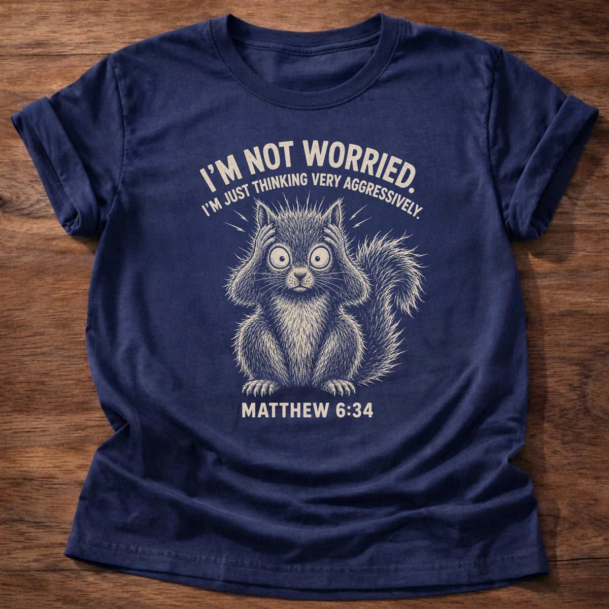 Navy t-shirt with a fluffed-up cat illustration reading 'I'm not worried, I'm just thinking very aggressively' Matthew 6:34 shirt